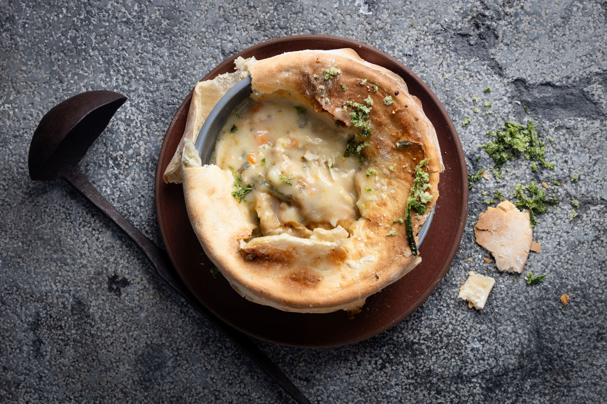 Baked chicken soup pie with flatbread topping