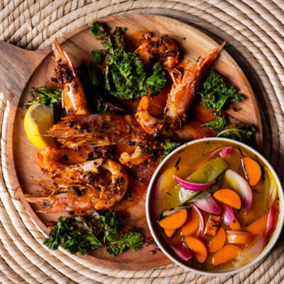 Chilli crunch prawns with crispy kale and pickled vegetables