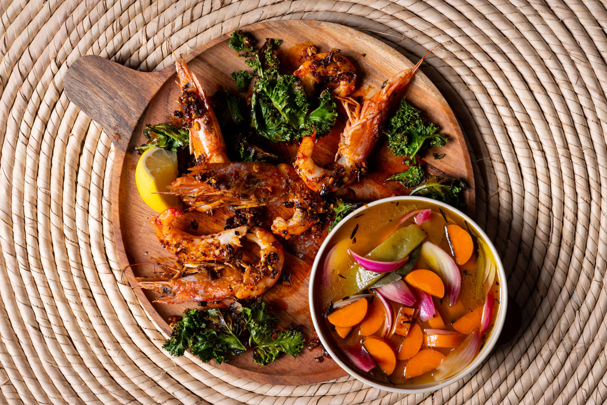 Chilli crunch prawns with crispy kale and pickled vegetables