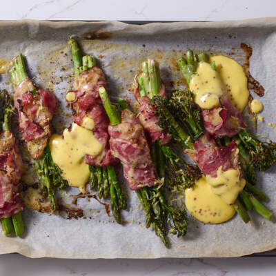 Beef rasher-wrapped greens with Hollandaise  