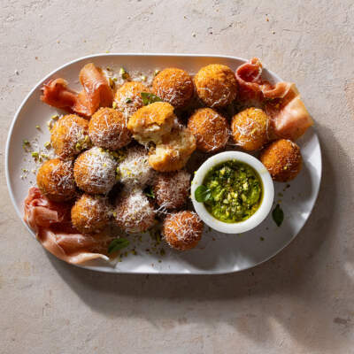 Grana Padano arancini with pistachio pesto and prosciutto