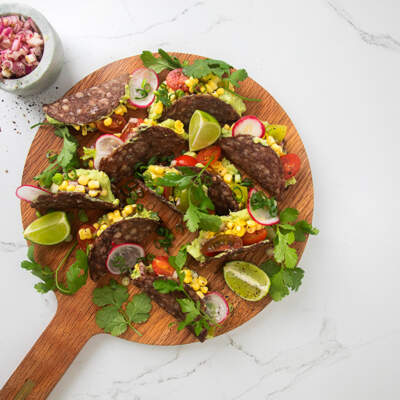 Droëwors taco shells with guacamole and salsa