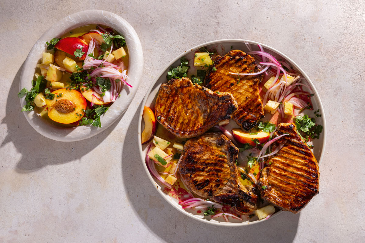 Smoky braaied pork chops with peach-and-pineapple salsa