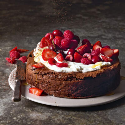 Chocolate torte with berries and whipped cream