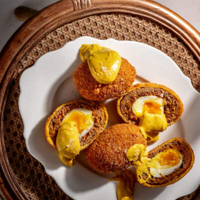 Scotch eggs with coronation sauce
