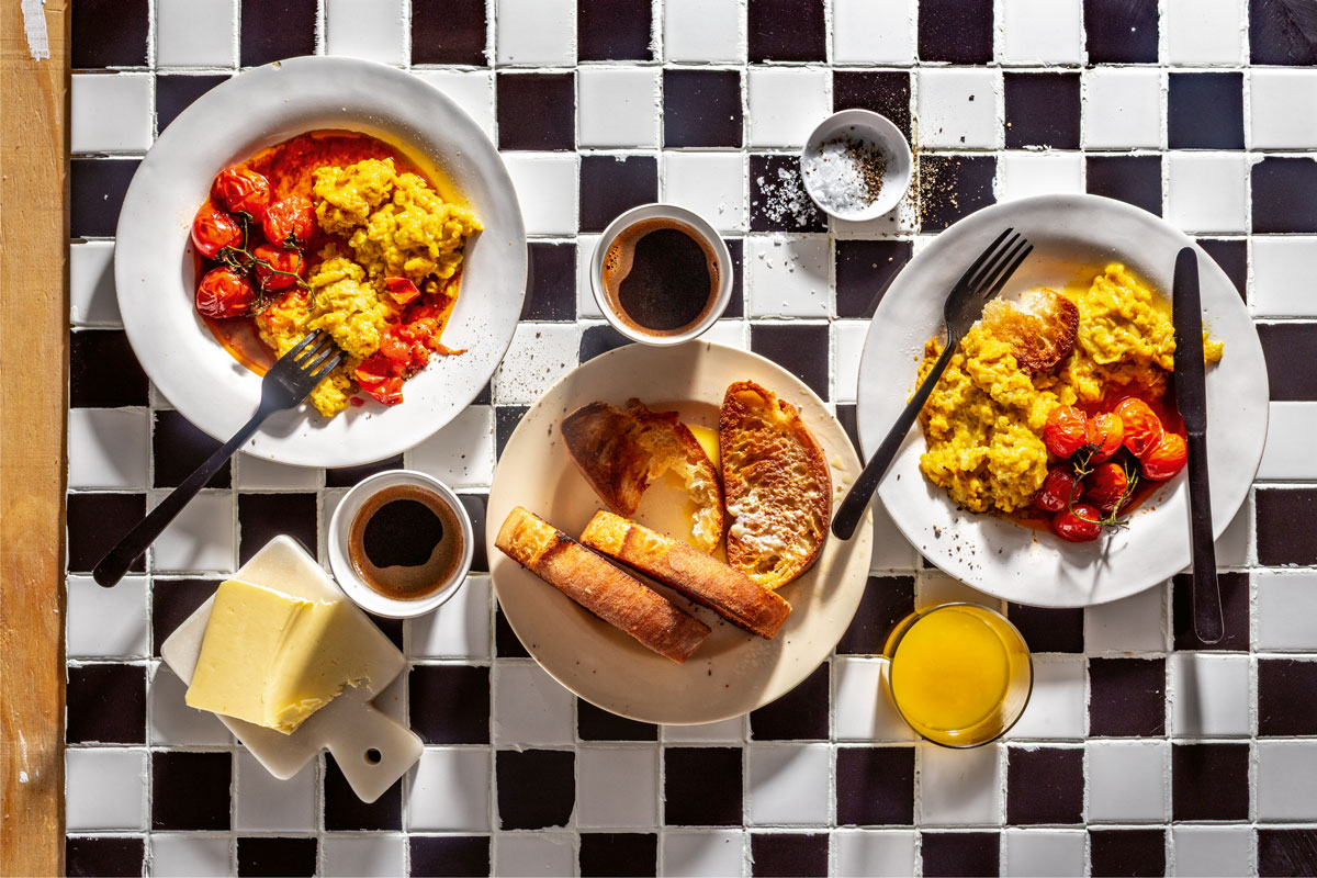 TURMERIC SCRAMBLE WITH JAMMY TOMATOES