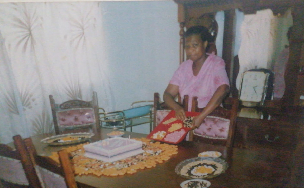 Mme Ruta preparing a birthday spread for one of her grandchildren with the same loving attention to detail that made her Dezemba celebrations so special.