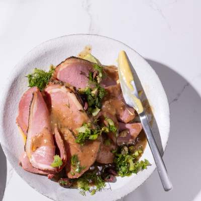 Sliced peppered roast beef with briny salsa