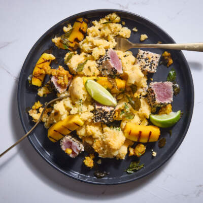 Sesame-seared tuna with chargrilled mango and mango atchar-dressed potato