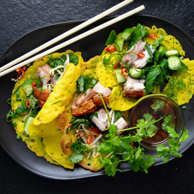 Vietnamese pancakes stuffed with roasted pork belly