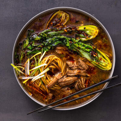 Pork ramen with onion chilli crunch pak choi