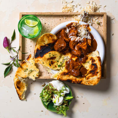 Tikka chicken curry with garlic and cheese naan