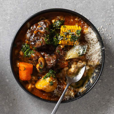 Easy lamb knuckle potjie with creamy Parmesan samp and beans 